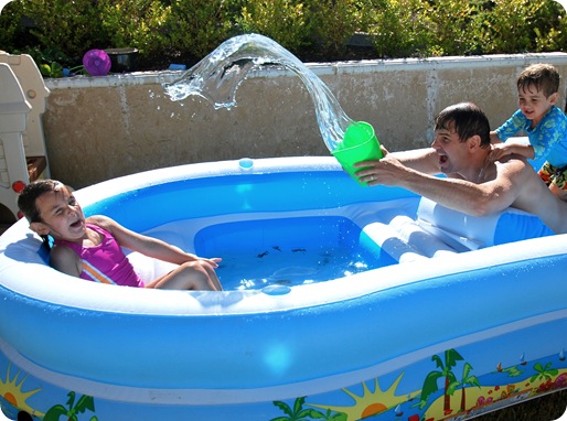 dad and kids in pool