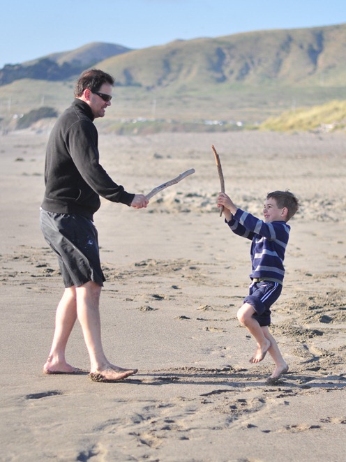 dad and son at beach