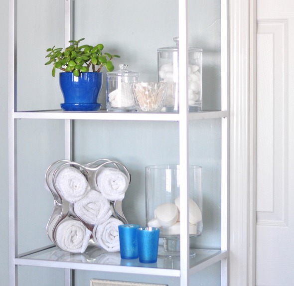 toiletries and handtowels on shelves