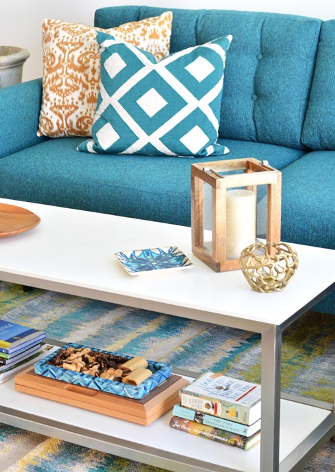 coffee table and teal sofa