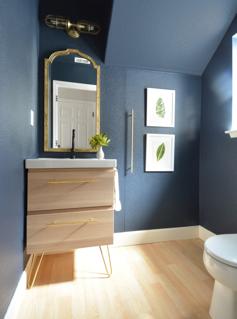 navy walls pale wood vanity
